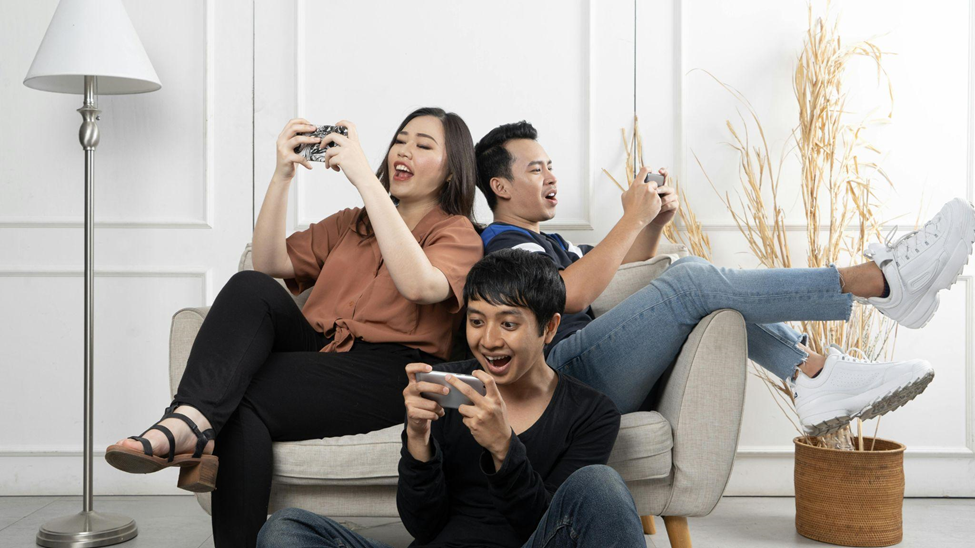 Friends playing games together on their smartphones